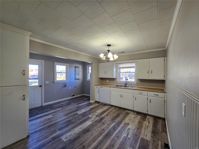 kitchen with white cabinets, white dishwasher, sink, crown molding, and dark hardwood / wood-style floors