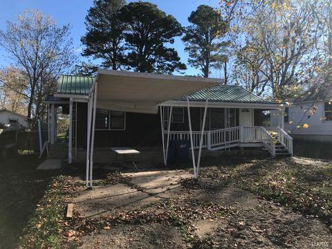 rear view of property with a carport