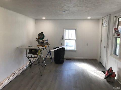 misc room featuring dark wood-type flooring and a textured ceiling