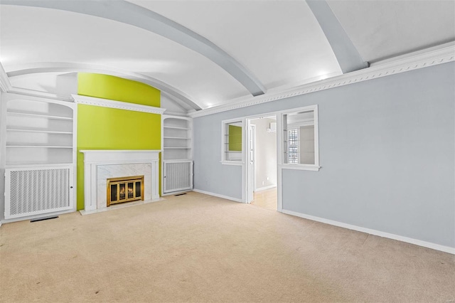 unfurnished living room featuring lofted ceiling, a high end fireplace, light carpet, and built in features