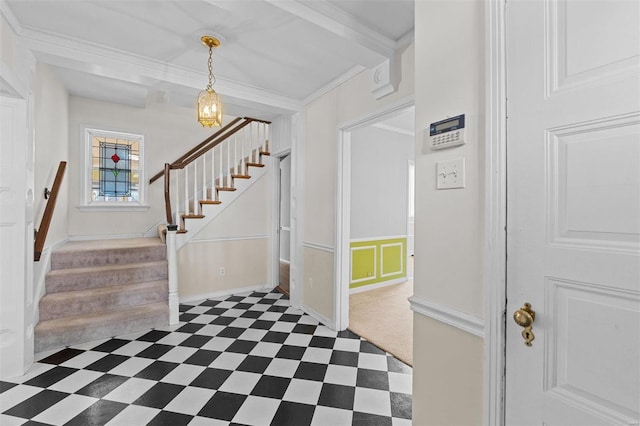 entrance foyer featuring crown molding