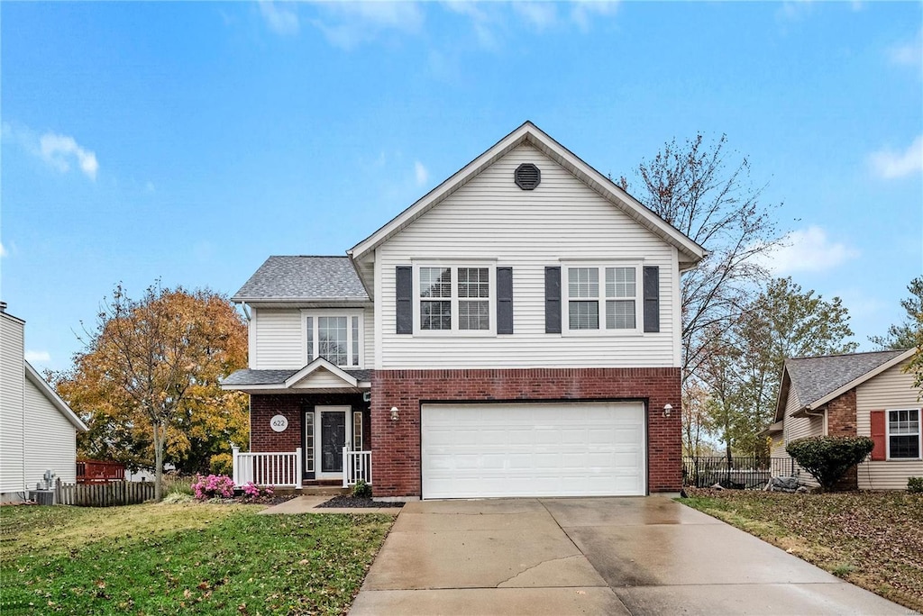 view of front property with a front yard and a garage