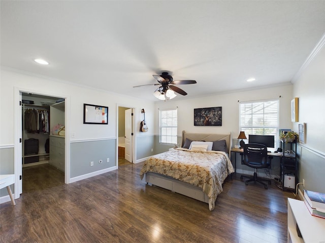 bedroom featuring ceiling fan, multiple windows, and dark hardwood / wood-style floors