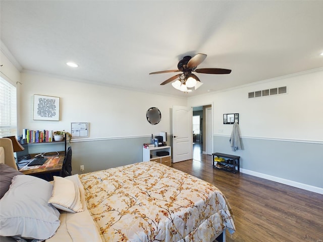 bedroom with ornamental molding, ceiling fan, and dark hardwood / wood-style floors