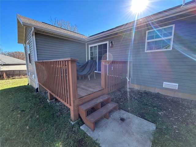 wooden deck with a yard