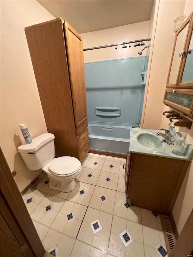 full bathroom with tile patterned flooring, vanity, shower / bathtub combination, and toilet