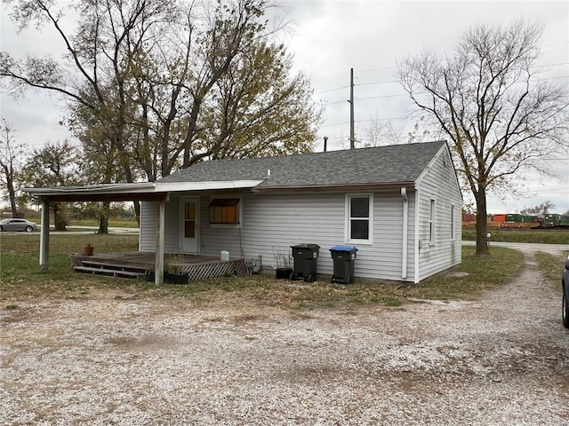 exterior space featuring a carport