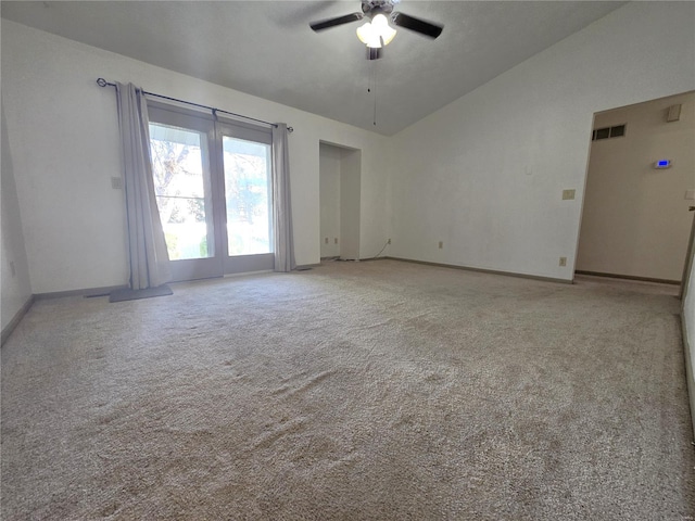 carpeted spare room with ceiling fan and lofted ceiling