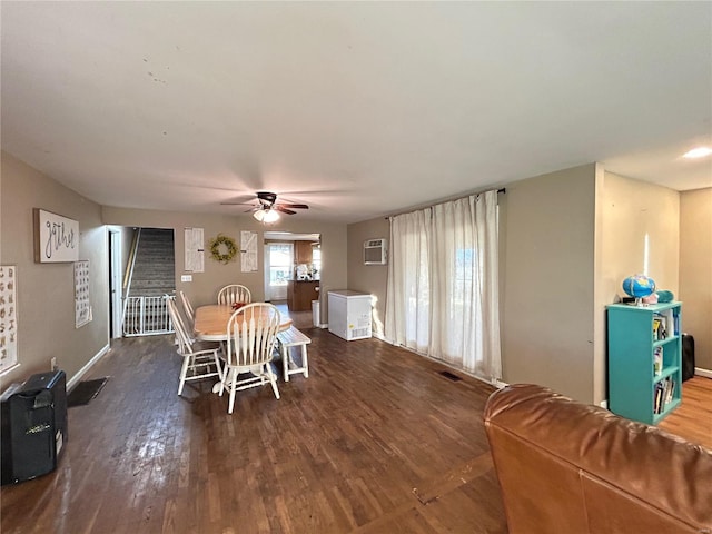 dining area featuring ceiling fan and dark hardwood / wood-style flooring