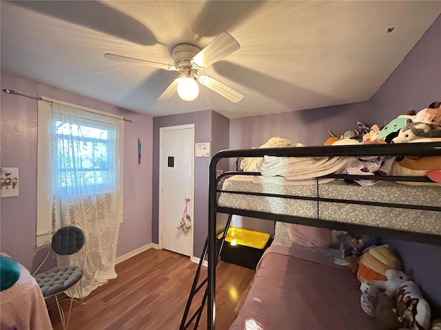 bedroom with hardwood / wood-style floors and ceiling fan