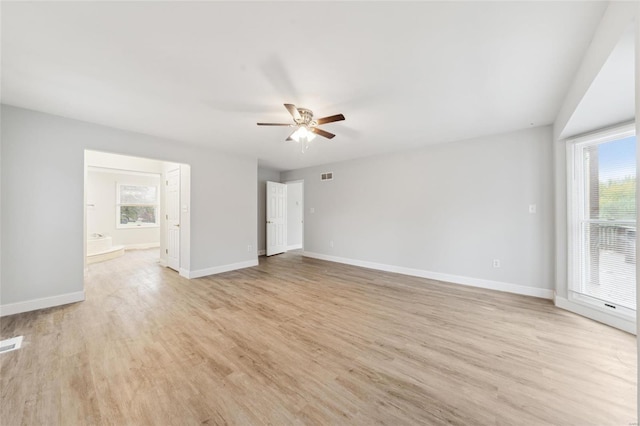 spare room with ceiling fan and light hardwood / wood-style floors