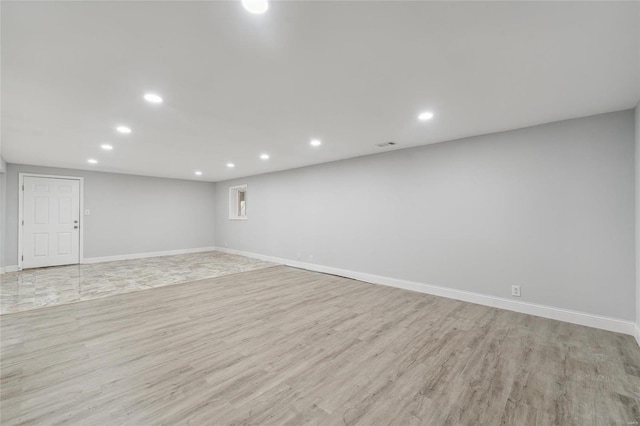 basement featuring light hardwood / wood-style flooring