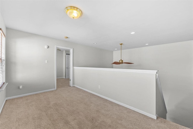 spare room featuring light colored carpet