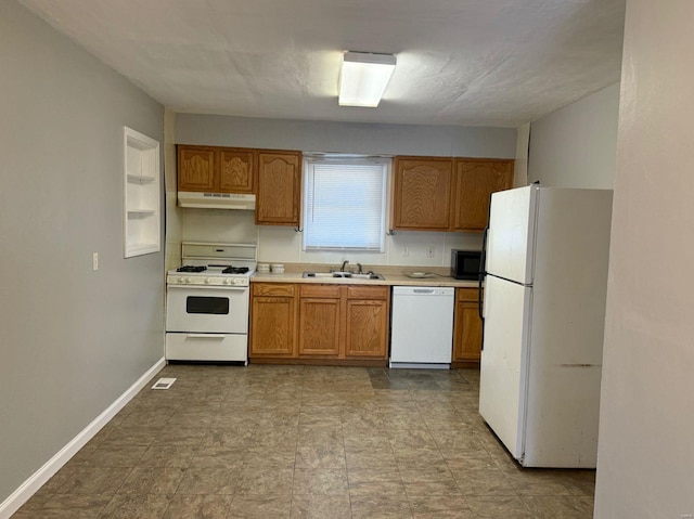 kitchen featuring white appliances and sink