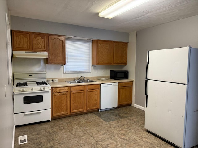 kitchen with white appliances and sink