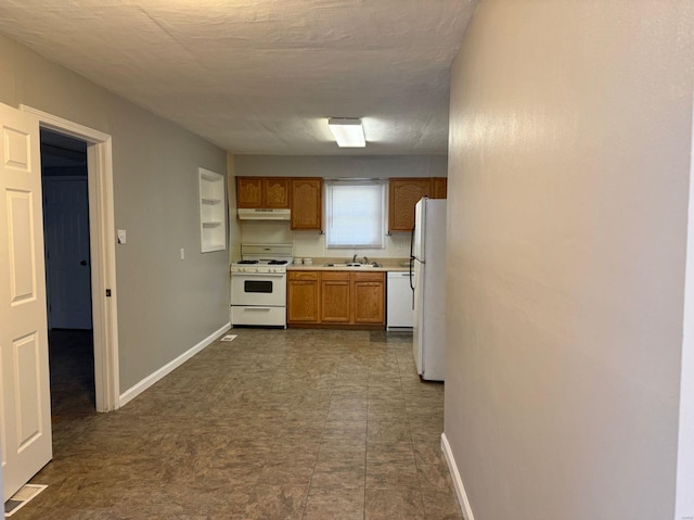 kitchen with sink and white appliances