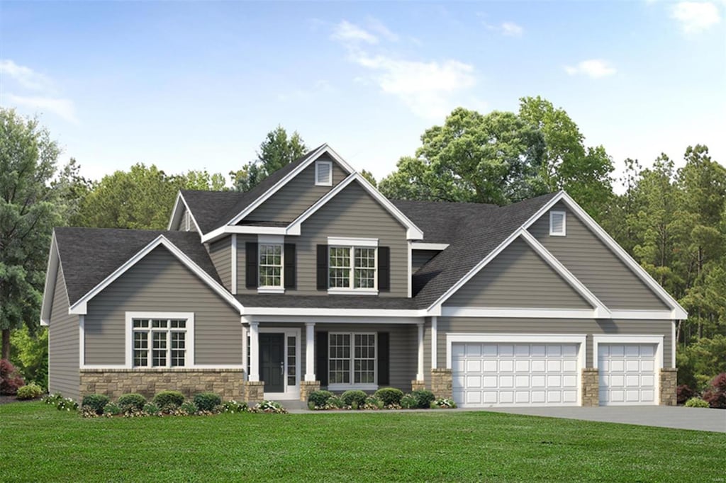 craftsman-style house featuring a front lawn and a garage