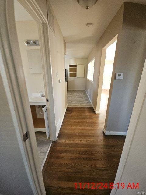 hallway featuring dark wood-type flooring