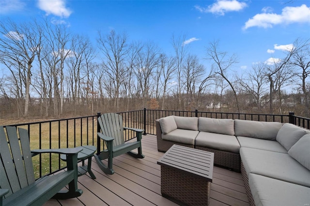 deck featuring an outdoor living space and a yard