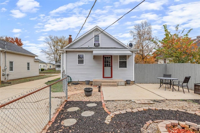 back of house featuring a patio area and an outdoor fire pit