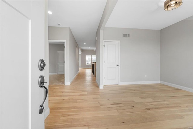 entryway with recessed lighting, baseboards, visible vents, and light wood-type flooring