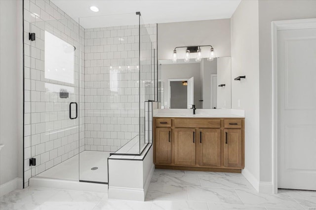full bathroom featuring a shower stall, marble finish floor, and baseboards