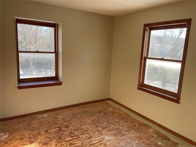 spare room featuring a textured ceiling