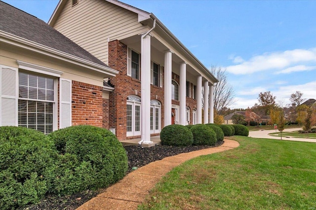 view of home's exterior featuring a lawn