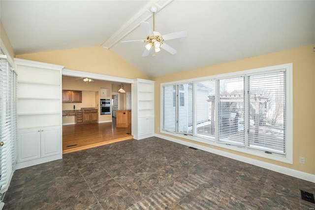 unfurnished living room featuring ceiling fan and lofted ceiling with beams