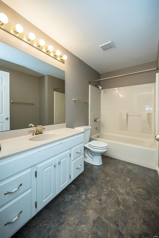 full bathroom with bathtub / shower combination, vanity, and toilet