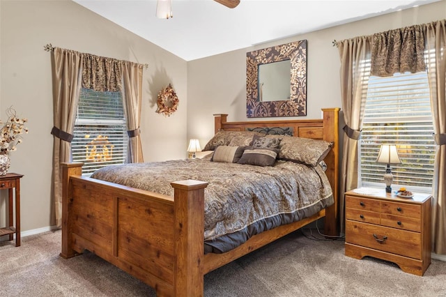 bedroom featuring ceiling fan, light colored carpet, and lofted ceiling