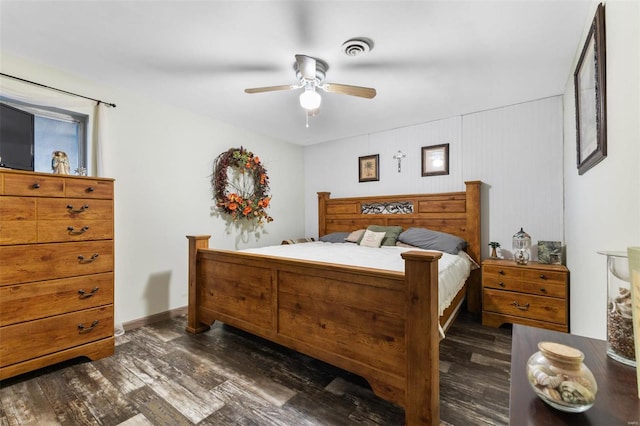 bedroom featuring ceiling fan and dark hardwood / wood-style floors