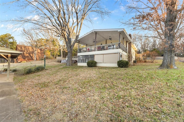 exterior space featuring ceiling fan