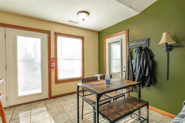 dining area with a textured ceiling