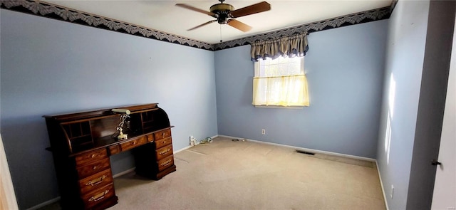 office space with ceiling fan and light colored carpet