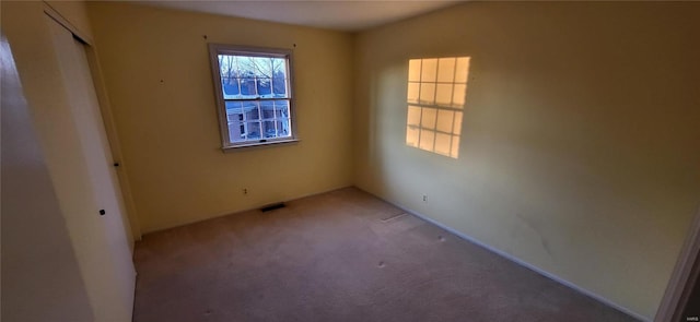 empty room with carpet flooring