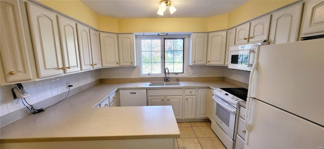 kitchen with decorative backsplash, white appliances, sink, and light tile patterned floors