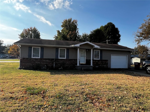 single story home featuring a garage and a front lawn