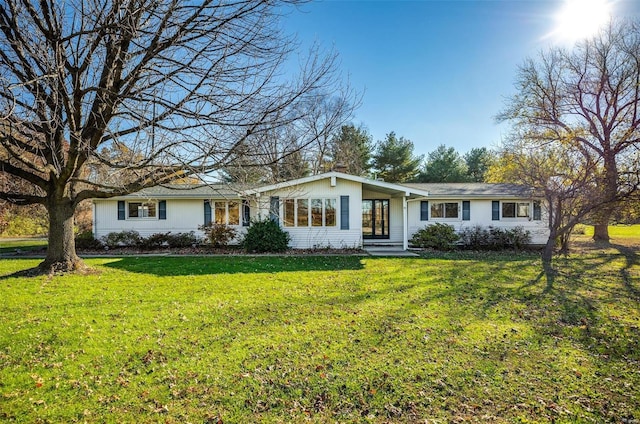 ranch-style home with a front yard