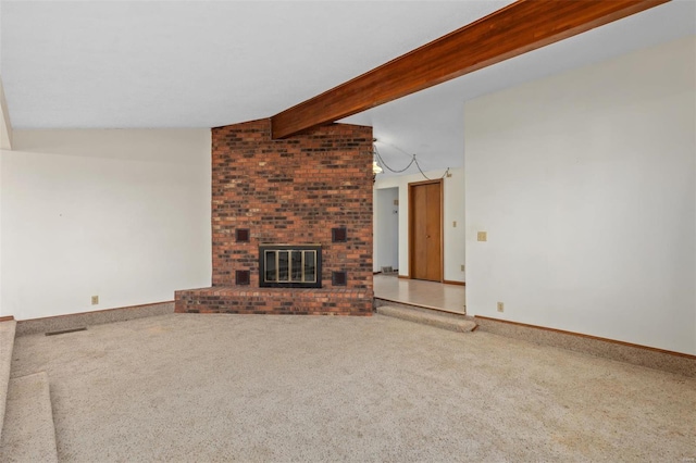 unfurnished living room with a brick fireplace, carpet flooring, and vaulted ceiling with beams