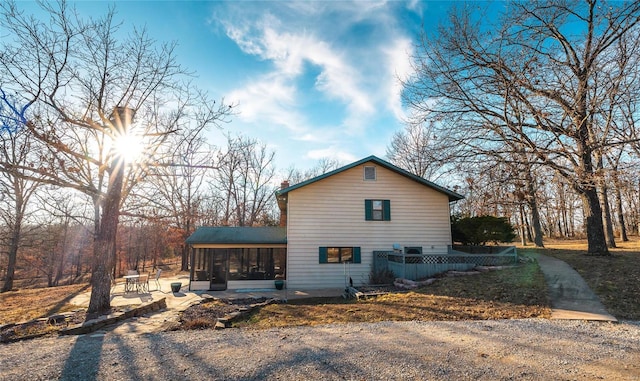 view of home's exterior featuring a sunroom