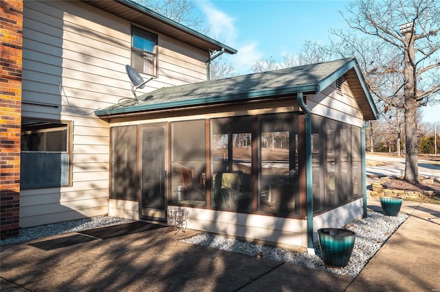 view of home's exterior featuring a sunroom