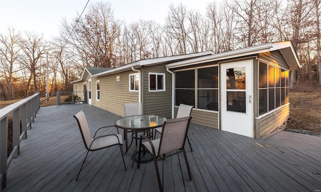 wooden terrace with a sunroom