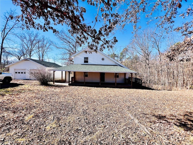 exterior space featuring a garage and covered porch