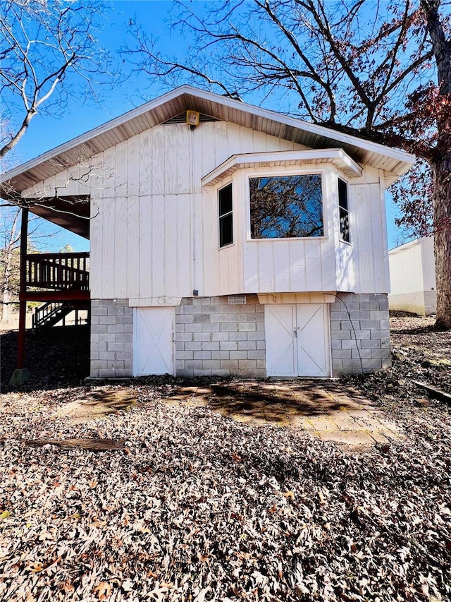 view of property exterior with a deck