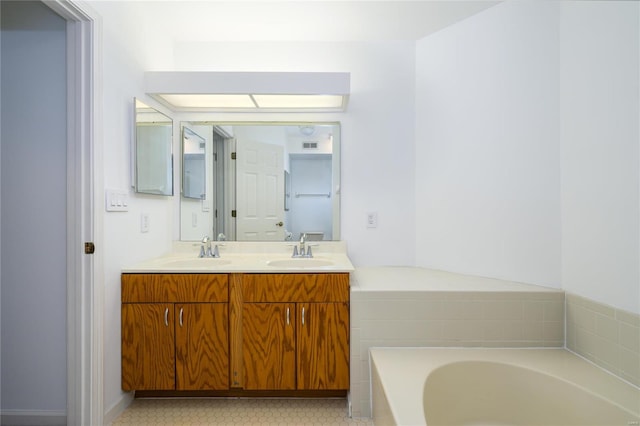 bathroom with vanity and a bathing tub