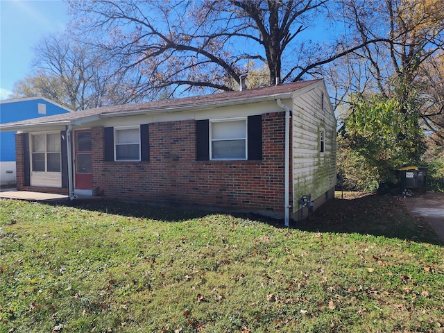 view of home's exterior with a yard