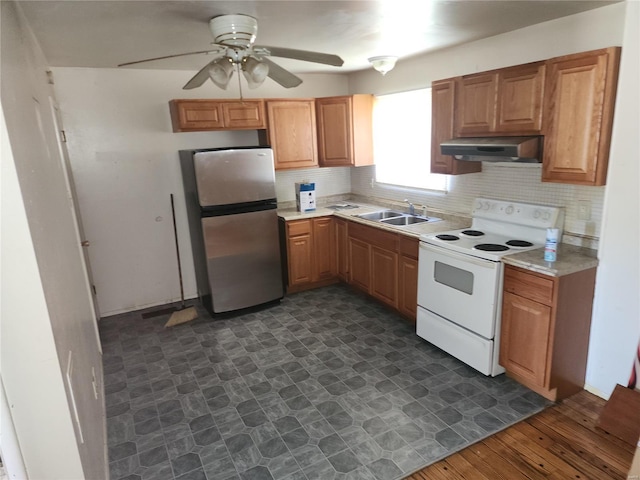 kitchen with sink, range hood, electric stove, dark wood-type flooring, and stainless steel fridge