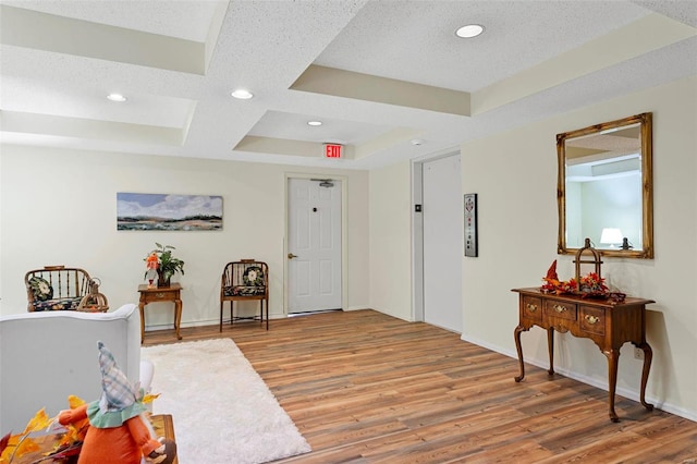 interior space featuring elevator and light wood-type flooring