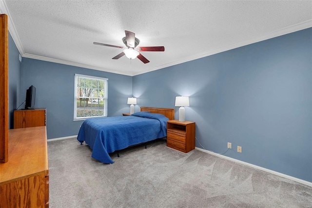 carpeted bedroom with a textured ceiling, ceiling fan, and ornamental molding